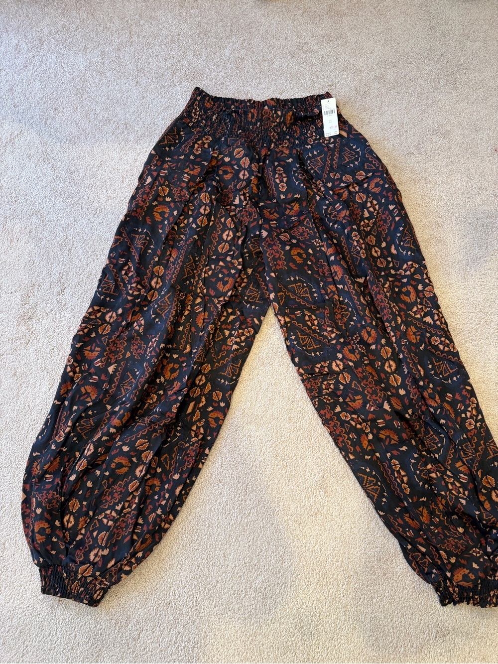 Anthropologie Black Joggers with Rust Floral Print